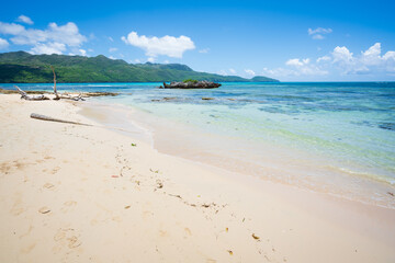Fototapeta na wymiar Beautiful Sandy beach blue sky and turquoise ocean in Rincon beach