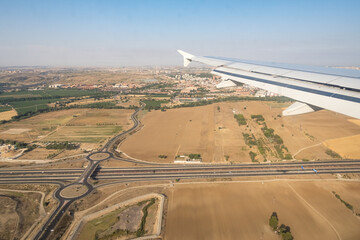 Looking through aircraft window while landing