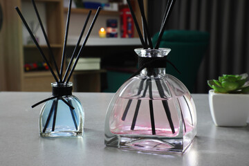 The luxury scented aroma room fresherner reed diffser glass bottle with black fiber sticks in the...