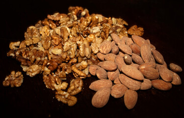 Closeup shot of  a salted almonds and walnuts