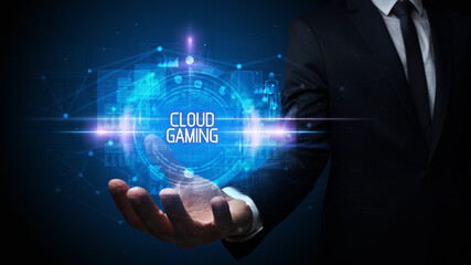 Man hand holding CLOUD GAMING inscription, technology concept