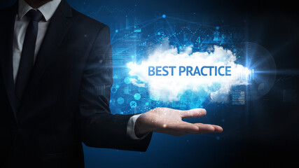 Hand of Businessman holding BEST PRACTICE inscription, successful business concept