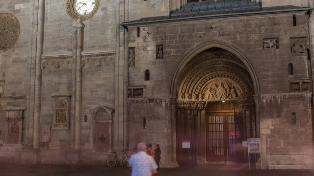 Entrance to St. Stephen's Cathedral night timelapse hyperlapse (Stephansdom, Domkirche St. Stephan), the mother church of Roman Catholic Archdiocese of Vienna and one of the tallest churches in the