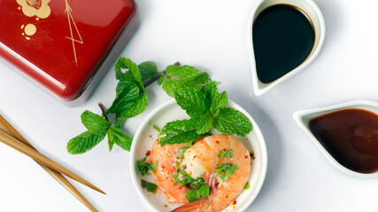 Top angle view of Prawns Dish with Chili and Soya Sauce . in a White bowl. Asian kitchen