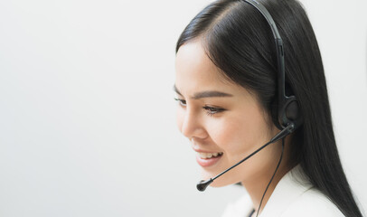 Young business asian woman working call centre customer service agents. Business female support operator with computer and headset in office.