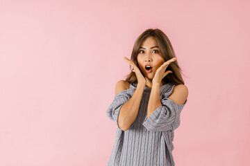 Portrait of a young Asian woman in surprise