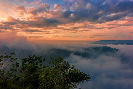 Beautiful landscape in golden hours sunrise sky above the foggy forest and hills