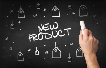 Hand drawing NEW PRODUCT inscription with white chalk on blackboard, online shopping concept
