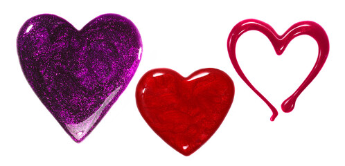 spilled nail polish in a shape of hearts on white background
