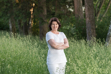 Portrait of a woman in white clothes on the nature