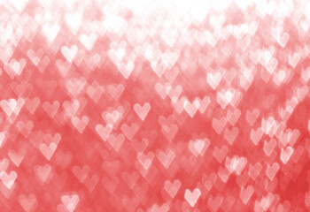 red background with heart shape snow bokeh out of focus 