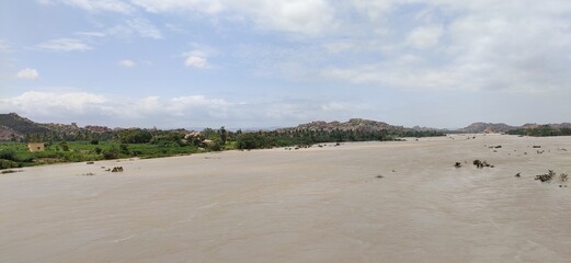 river that is across the historical town hampi , lakes