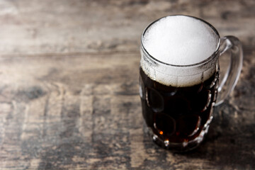 Traditional kvass beer mug on wooden table