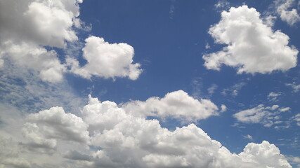 The sky and white clouds in the daytime.