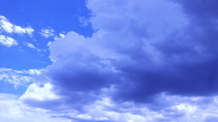 The sky and white clouds in the daytime.