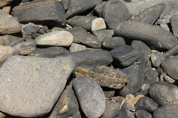 Sea pebble. Sea stones background. Beach rocks.