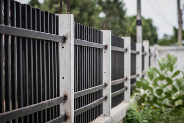 Black iron cage fence Fence house Looking through the green nature. Freedom and independent concepts