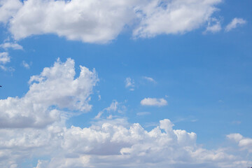 Bright blue sky with fluffy white clouds. Clearing day and Good weather. Blue sky background.