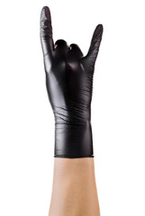 Hand in black gloves showing rock n roll sign or giving the devil horns gesture