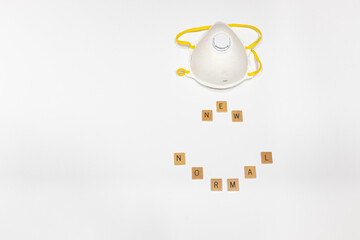 N95 mask and new normal spelled out against a white background