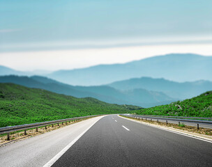 Mountain highway with blue sky and rocky mountains on a background