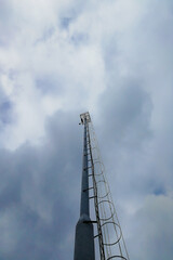 Obraz premium Technology on top of telecommunication GSM 5G tower. Cellular phone antennas on a building roof.