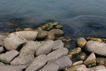 Fototapeta na wymiar Sea pebble. Sea stones background. Beach rocks.