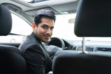 Fototapeta na wymiar Confident Business Executive In Car
