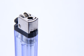 gas lighter with transparent blue container. a tool to burn against a white background