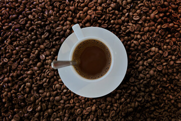 Freshness hot  coffee with coffee beans background
