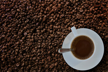 Freshness hot  coffee with coffee beans background

