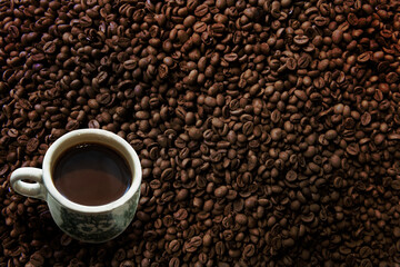 Freshness hot  coffee with coffee beans background
