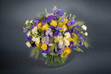 Big and small bouquet on grey background