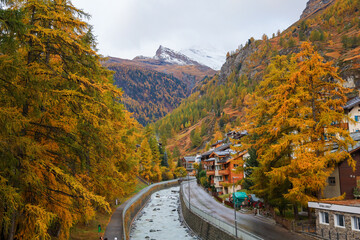 Zermatt, Switzerland-October 21, 2019:The Old Building on Zermatt Bahnhofstrasse street in autumn and rainny day. ,Zermatt is a famous nature village in Switzerland.