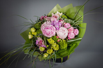 Big and small bouquet on grey background