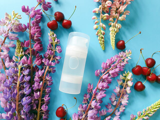 Intimate lubricant gel Transparent bottle Mock-up, multicolored flowers with long stem and cherry...