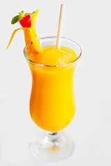 Fresh tropical fruit smoothie mango juice on restaurant. Mango shake close up. Tropical fruit concept