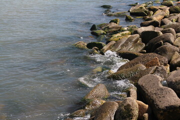 Naklejka na ściany i meble Sea pebble. Sea stones background. Ocean beach rocks.