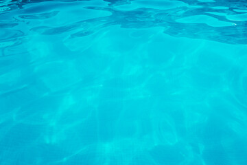 Turquoise water with small ripples from a relaxing pool.