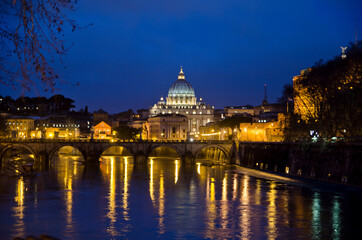 Night view ofSt. Peter's Basilica as seen from the river in Rome.