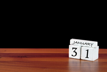 31 January calendar month. 31 days of the month. Reflected calendar on wooden floor with black background