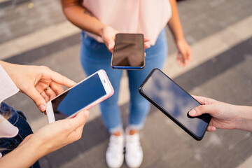 Close up of girl's hand using smartphone - young addicted to technlogy and social network - concept of connection