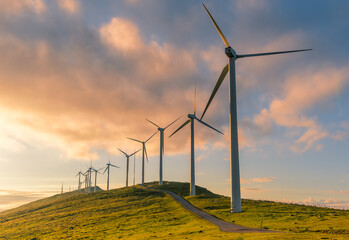 wind turbine in the hill at sunset