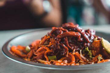 Fried noodles with squid in Penang Malaysia