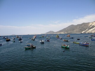 Fototapeta na wymiar View over the harbour of Samanco near Chimbote, Peru with the Isla Blanca (White Island) in the background 