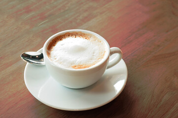 Hot latte coffee Served with a white ceramic cup
