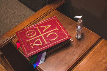 Book of Gospels with Hand Sanitizer