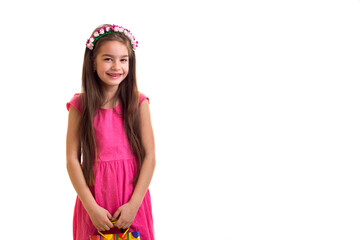 Cute little girl in pink dress at white background