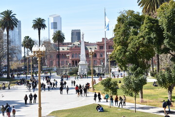 People walking around the park of the Argentine president. Historic park and buildings. Buenos...