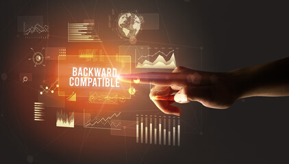 Hand touching BACKWARD COMPATIBLE inscription, new business technology concept